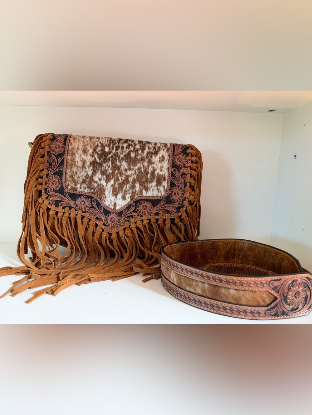 fringed cowhide crossbody bag